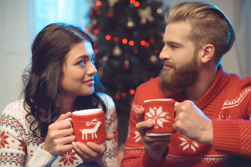 couple with hot drinks on christmas - Photo, Image