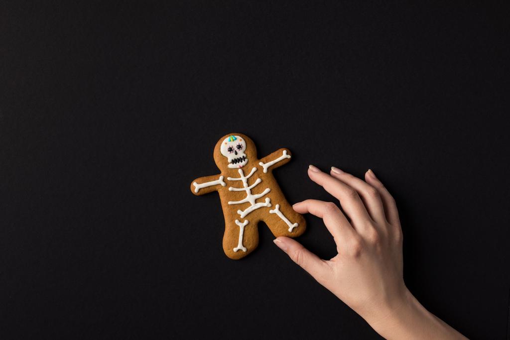 hand with halloween cookie - Photo, Image