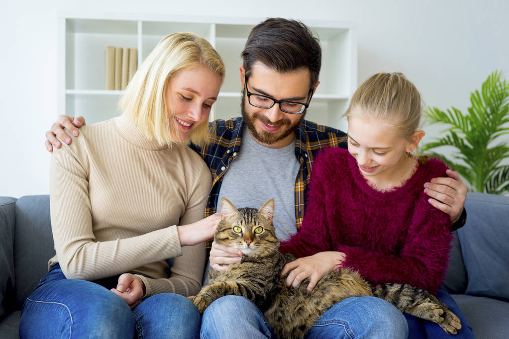 Family with a cat - Photo, Image
