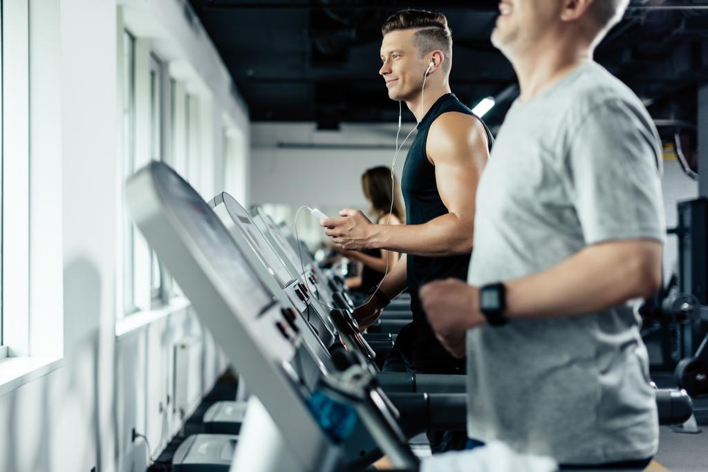 sportsmen training on treadmills  - Photo, Image