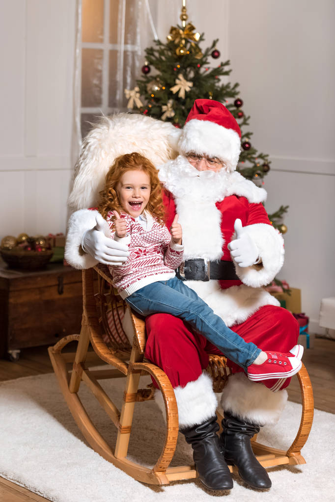 Santa claus en kid - Foto, afbeelding