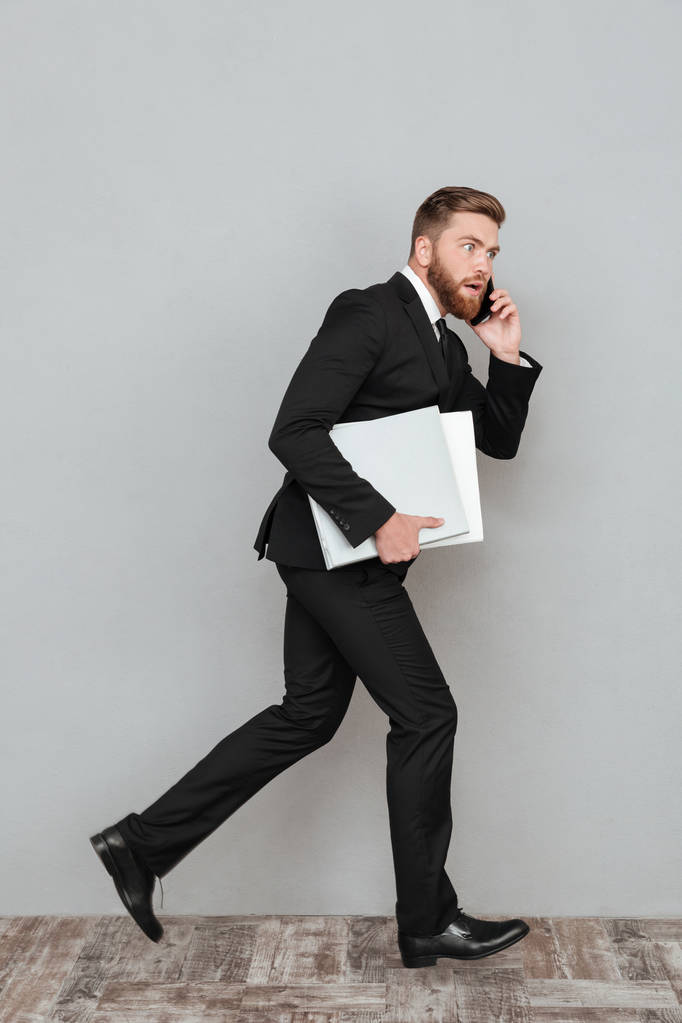 Full length image of a surprised bearded man in suit - Photo, Image