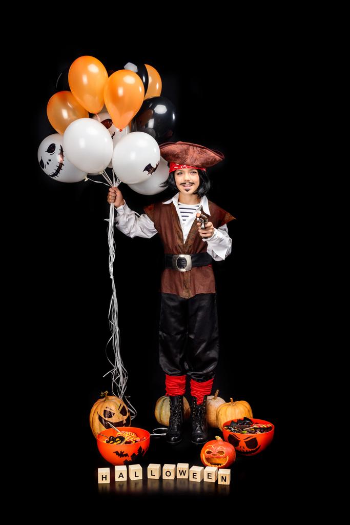 pirate with balloons, pumpkins and sweets - Photo, Image