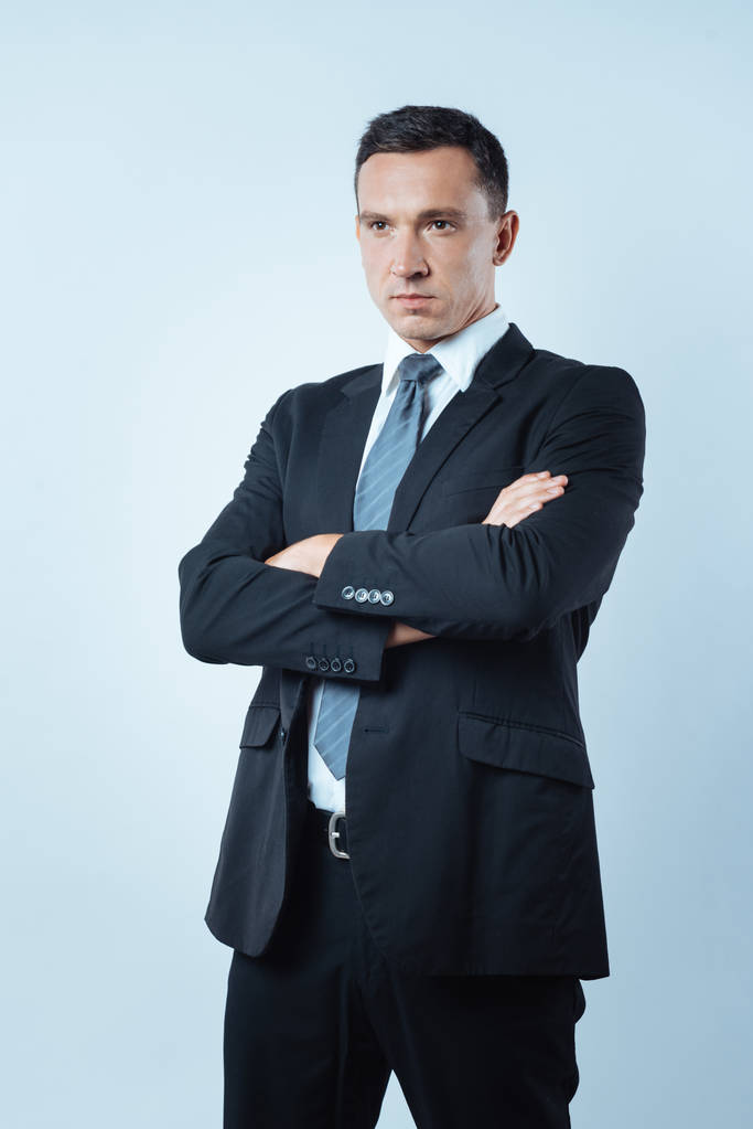Serious smart businessman crossing his arms - Photo, Image