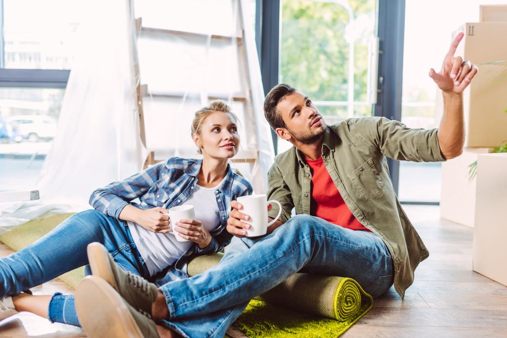 couple drinking tea in new apartment - Photo, Image
