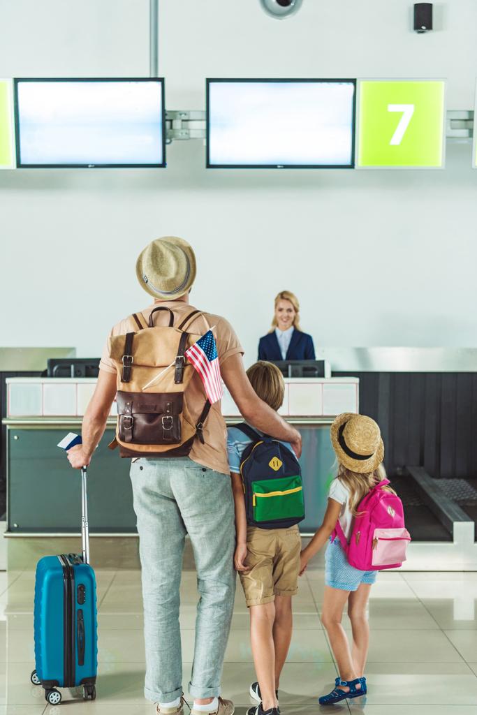 family going to check in desk - Photo, Image