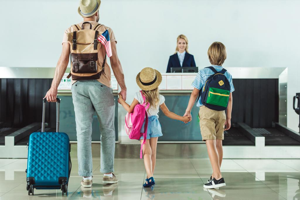 family going to check in desk - Photo, Image