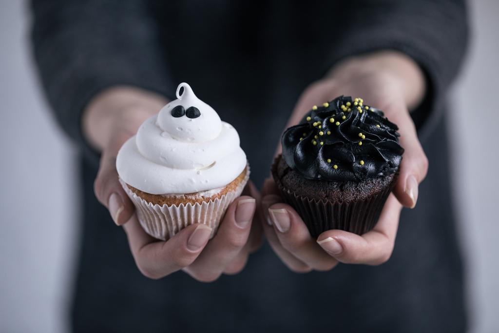 person holding halloween cupcakes - Photo, Image