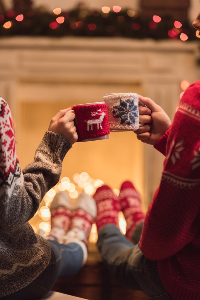 couple with cups at christmastime - Photo, Image