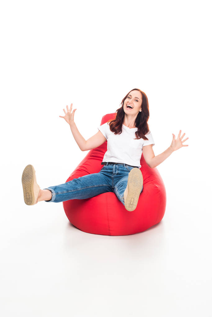 excited woman on bean bag chair - Photo, Image