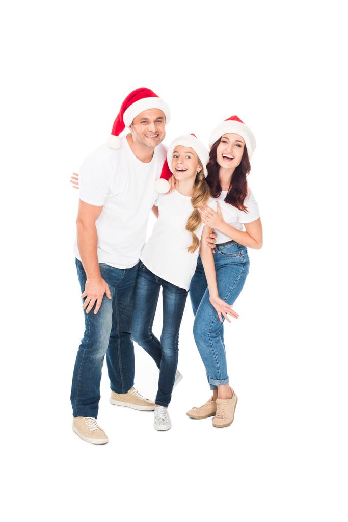 hugging family in Santa hats - Photo, Image