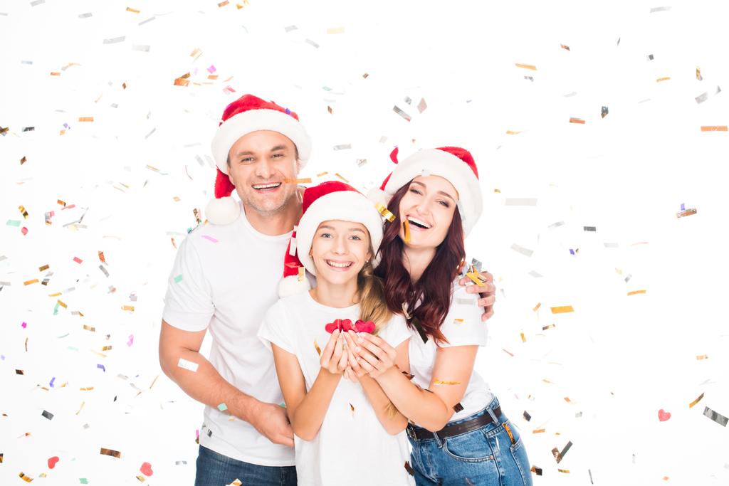 Bonne famille avec confettis de Noël
 - Photo, image