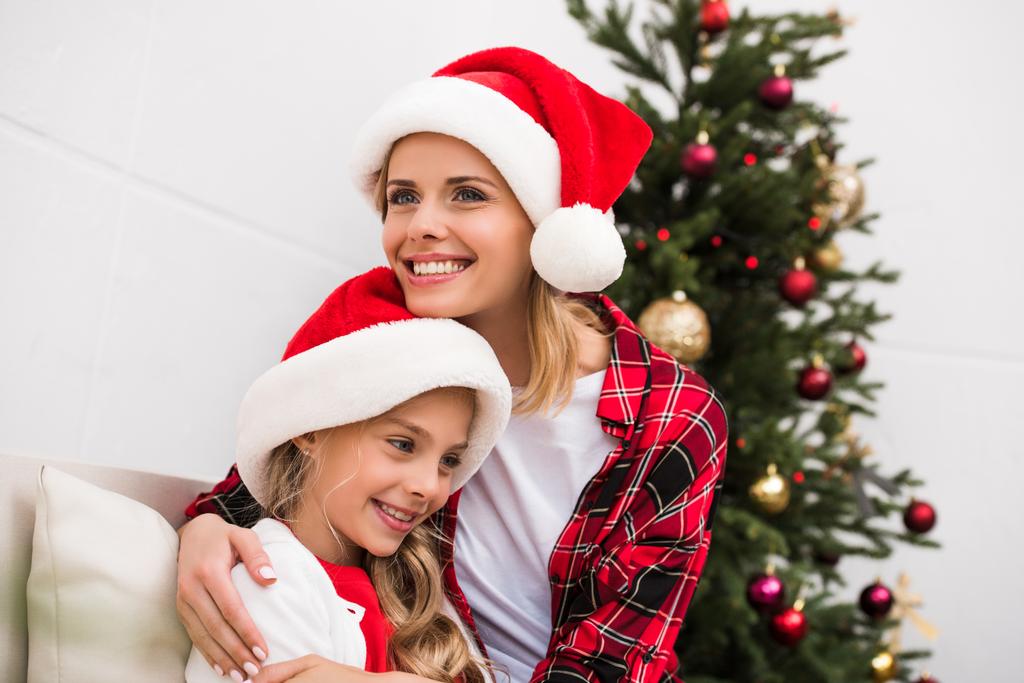 happy mother and daughter at christmas - Photo, Image