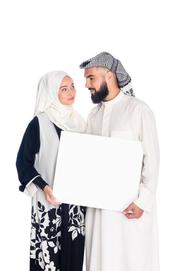 Muslim Couple Holding Blank Board Isolated On Free Stock Photo and Image