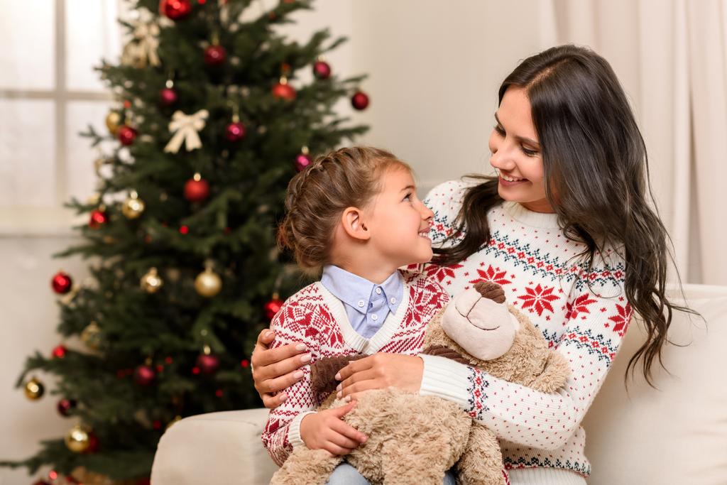 mother and daughter with teddy bear - Photo, Image