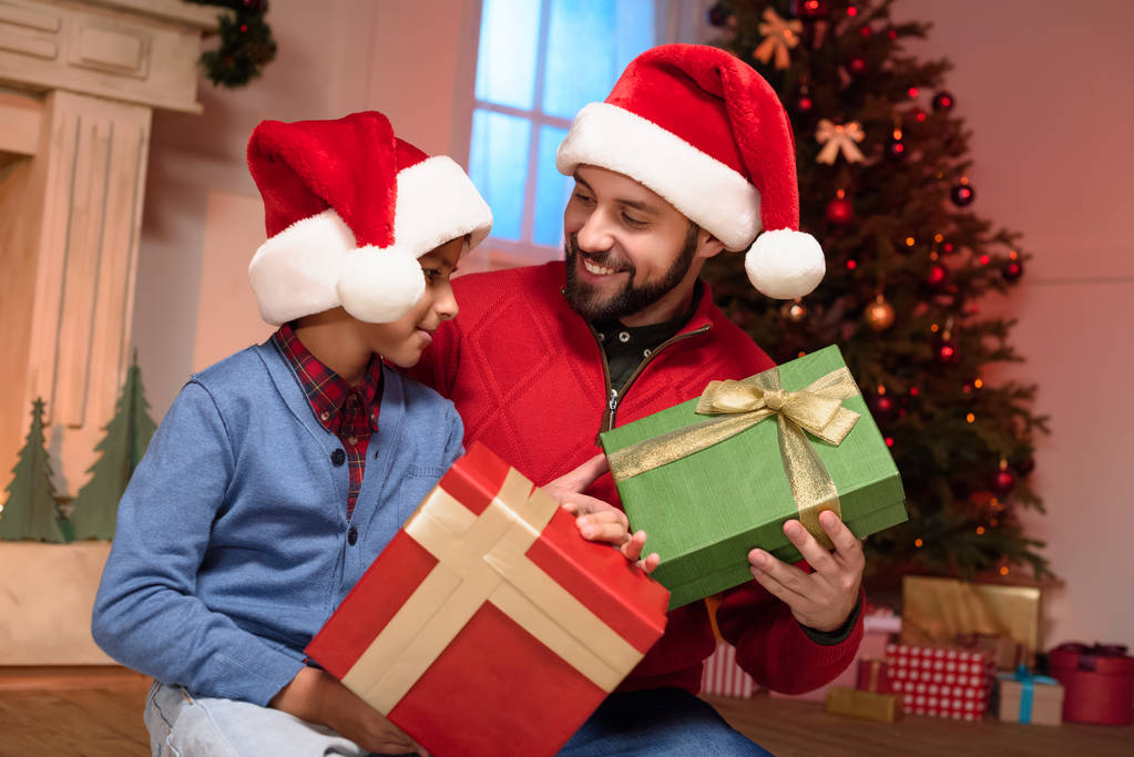 father and son with christmas presents  - Photo, Image