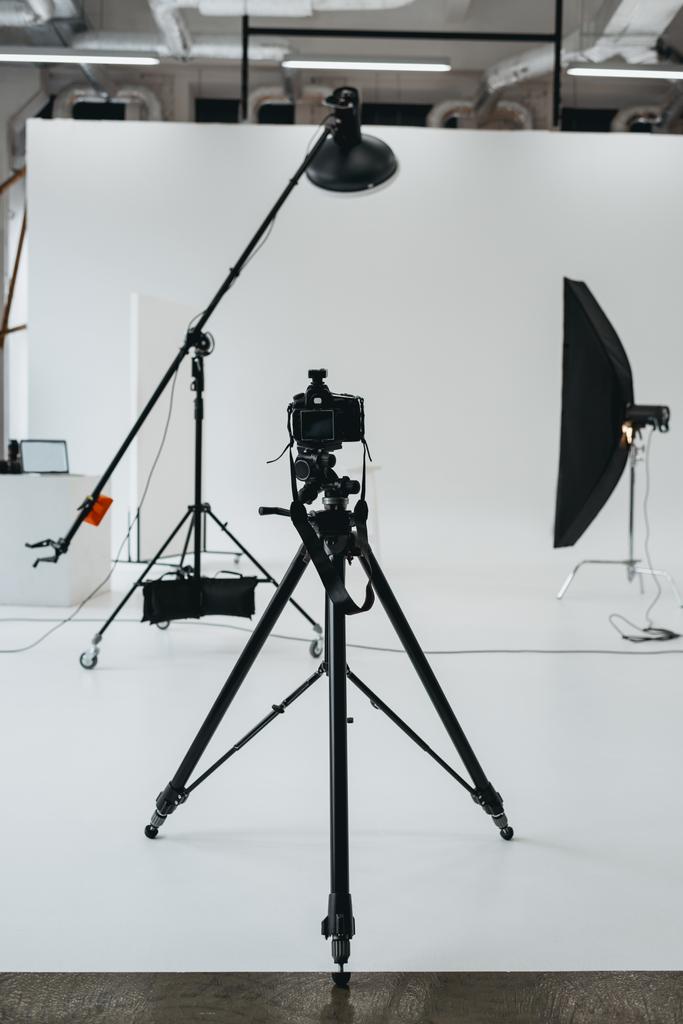 camera in photo studio with lighting equipment - Photo, Image