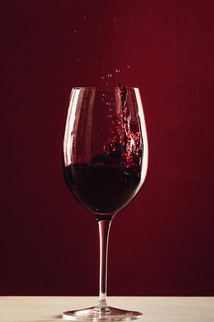 splash of wine in wineglass - Photo, Image