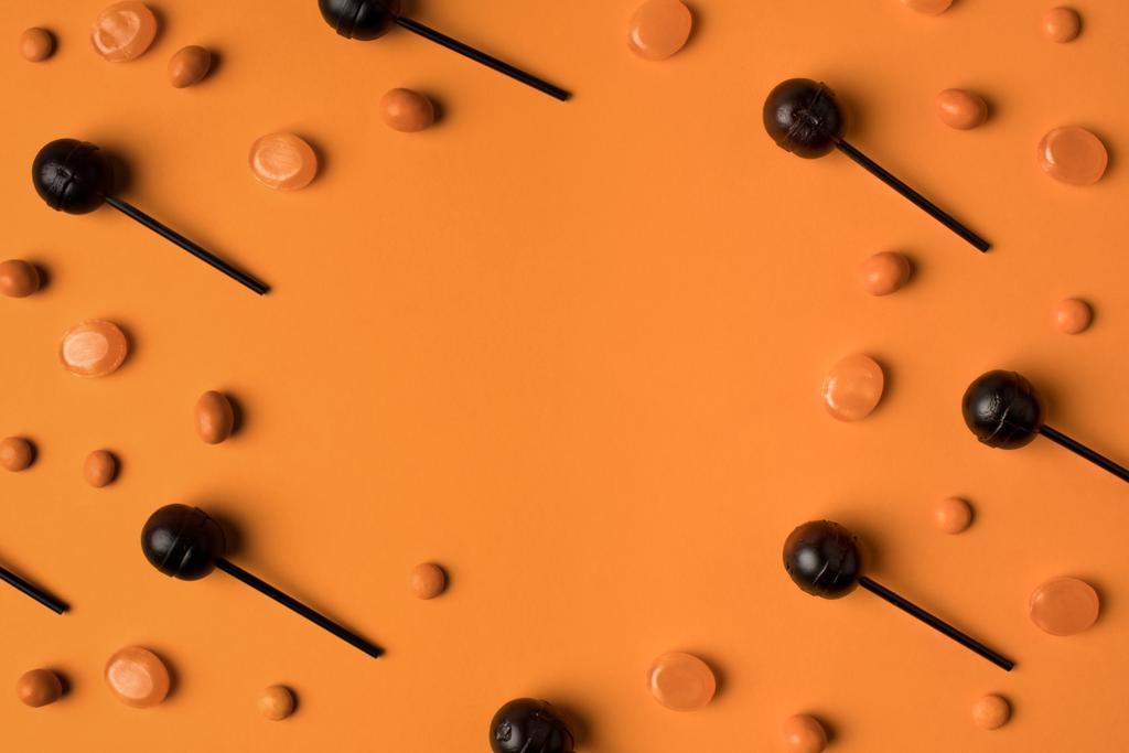 чорні та помаранчеві льодяники
 - Фото, зображення