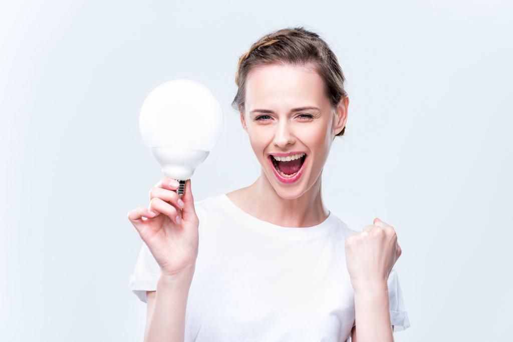 woman with light bulb - Photo, Image