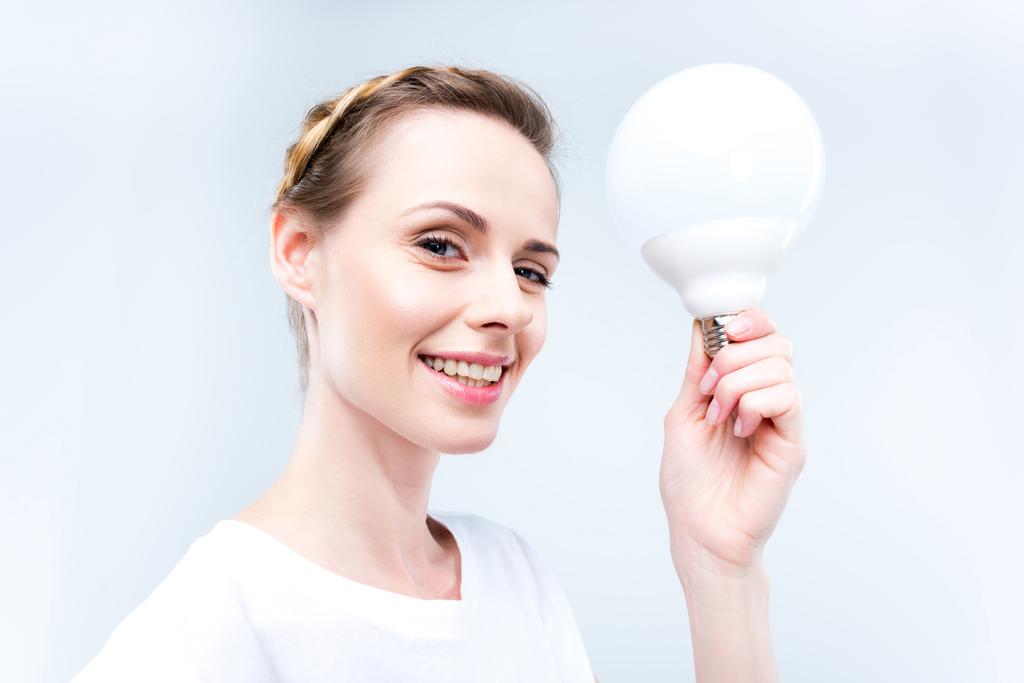woman with light bulb - Photo, Image