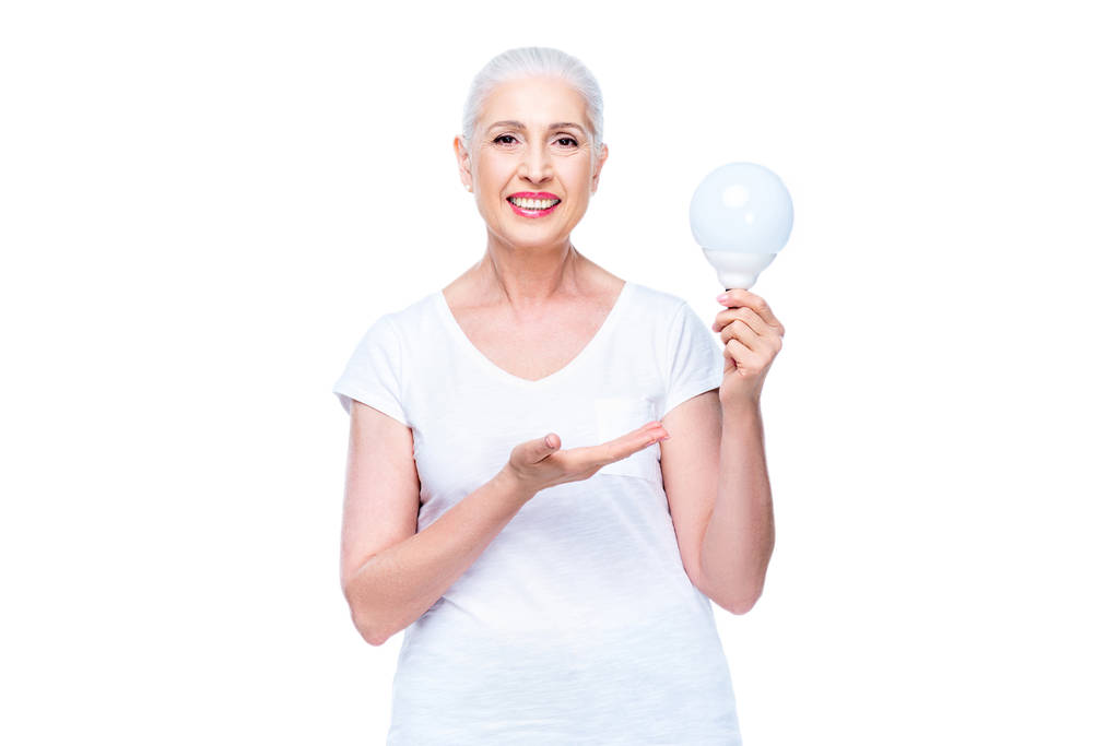 mulher idosa com lâmpada
 - Foto, Imagem