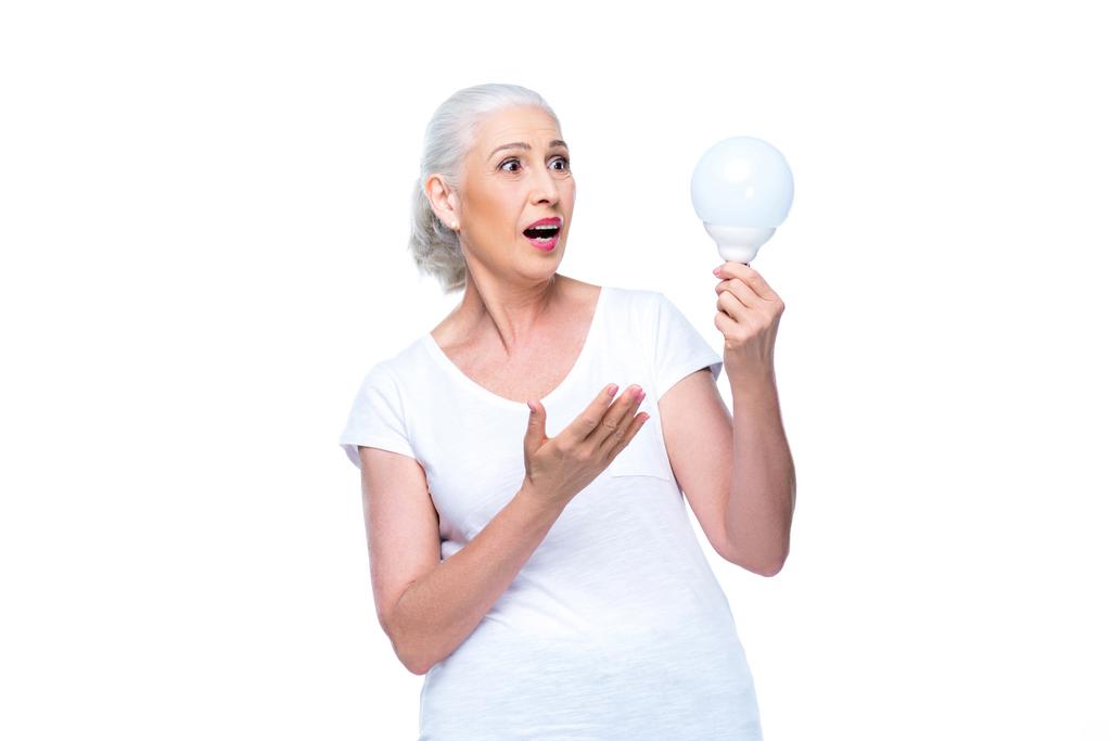 shocked woman with light bulb - Photo, Image