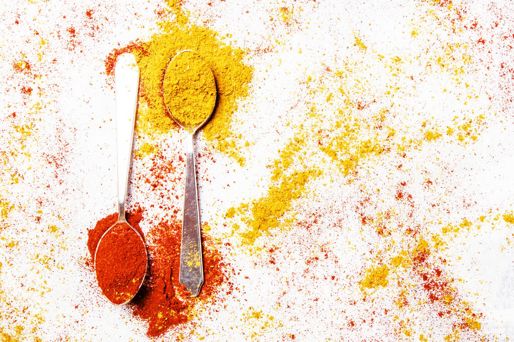 Spoon with ground chilli and turmeric  - Photo, Image