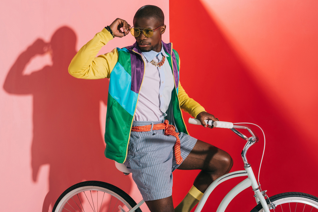 stylish man riding bicycle - Photo, Image