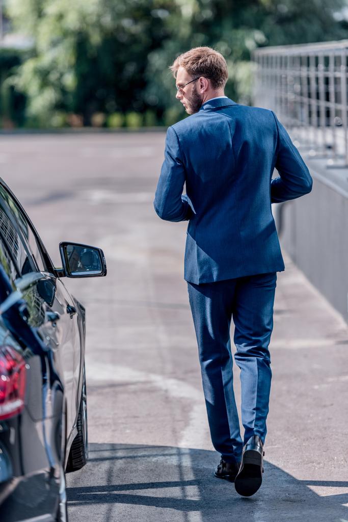businessman in suit at car - Photo, Image