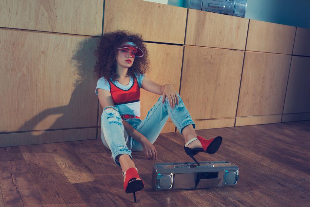 fashionable woman with boombox sitting on floor - Photo, Image