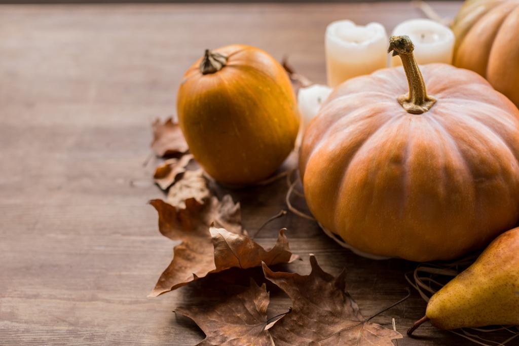 pumpkins and candles on table - Photo, Image