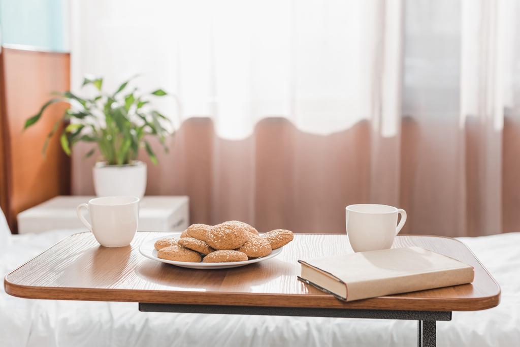 cookies and book in hospital room - Photo, Image