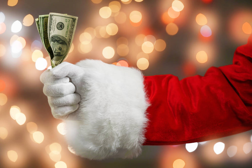 Père Noël tenant de l'argent
   - Photo, image