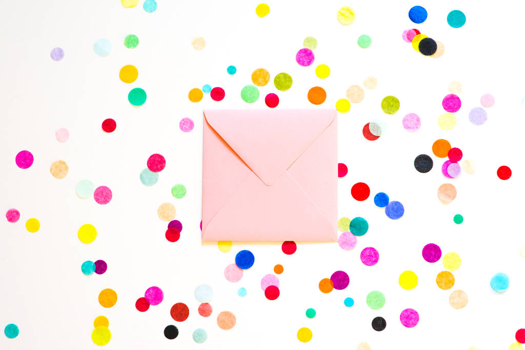Holiday background with envelope confetti, birthday concept. - Photo, Image