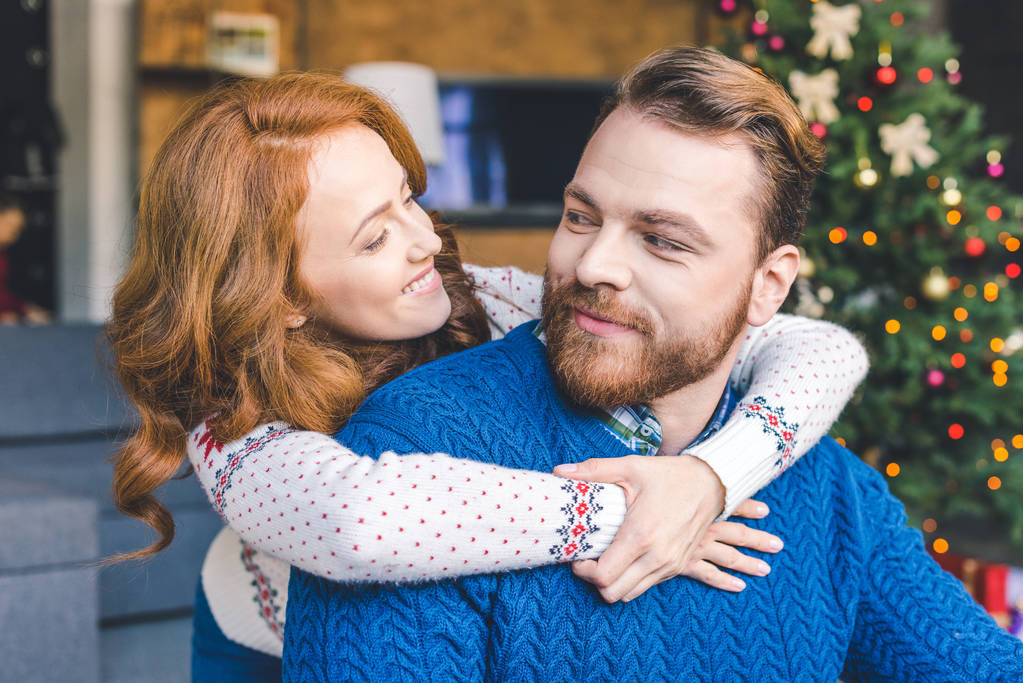 couple in warm sweaters embracing - Photo, Image