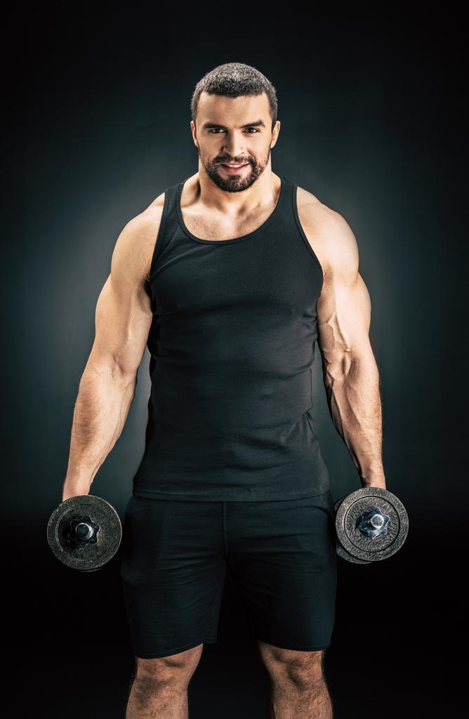 man with dumbbells in hands - Photo, Image