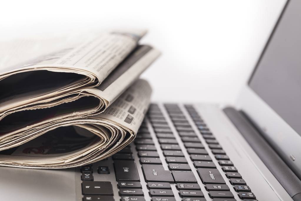 Newspapers on the laptop Isolated.  - Photo, Image
