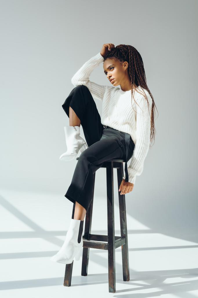 african american model posing with stool - Photo, Image
