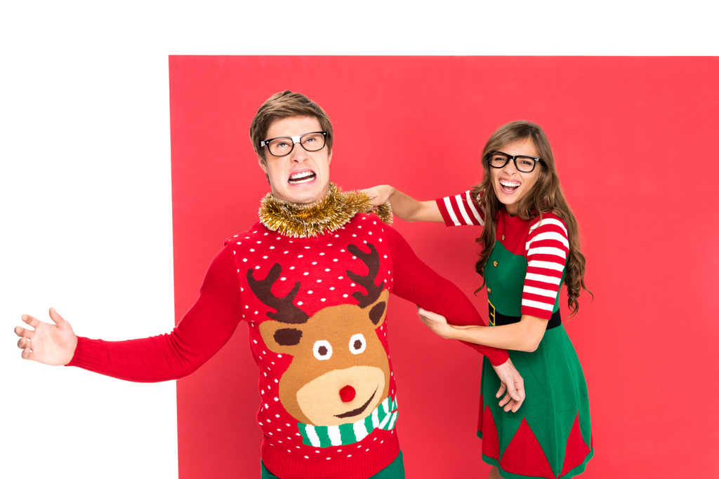 casal em trajes de Natal se divertindo
 - Foto, Imagem