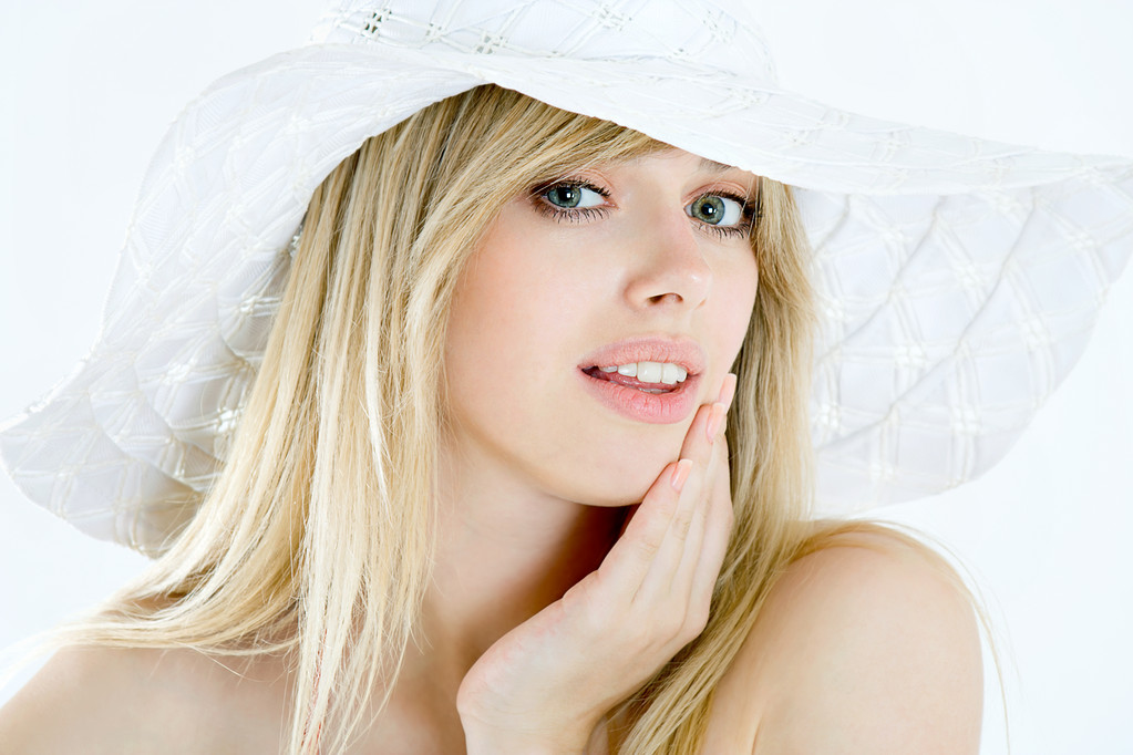 Portrait of pretty cheerful woman wearing straw hat in sunny war - Photo, Image