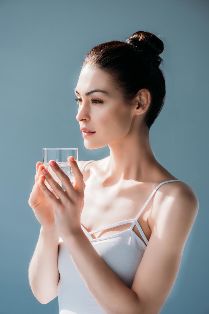 Young woman holding glass of water - Photo, Image