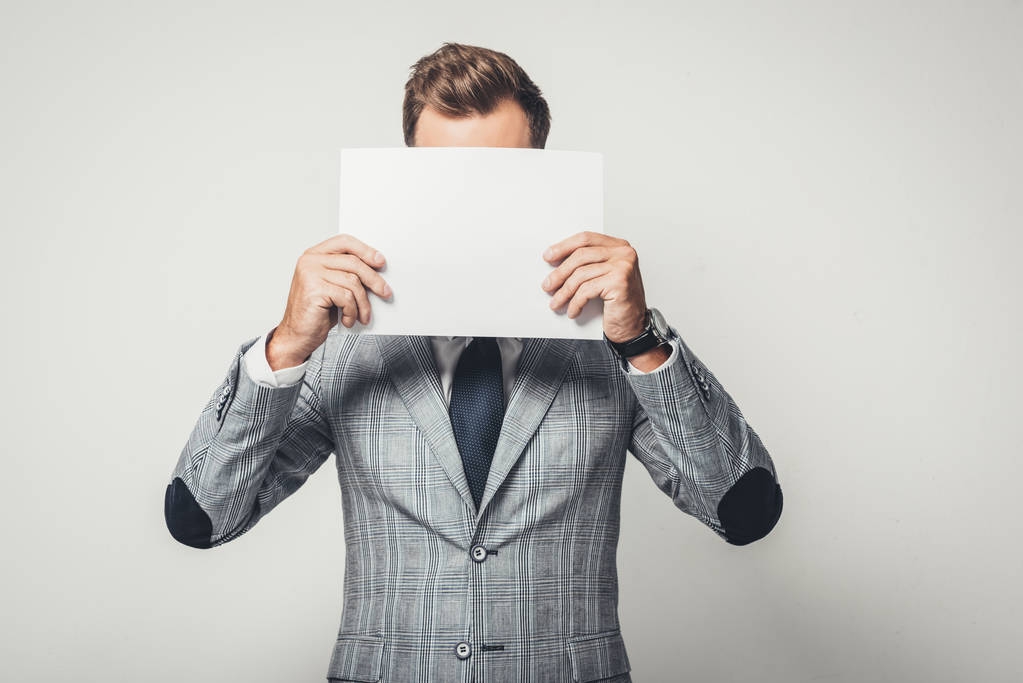 businessman covering face with paper - Photo, Image