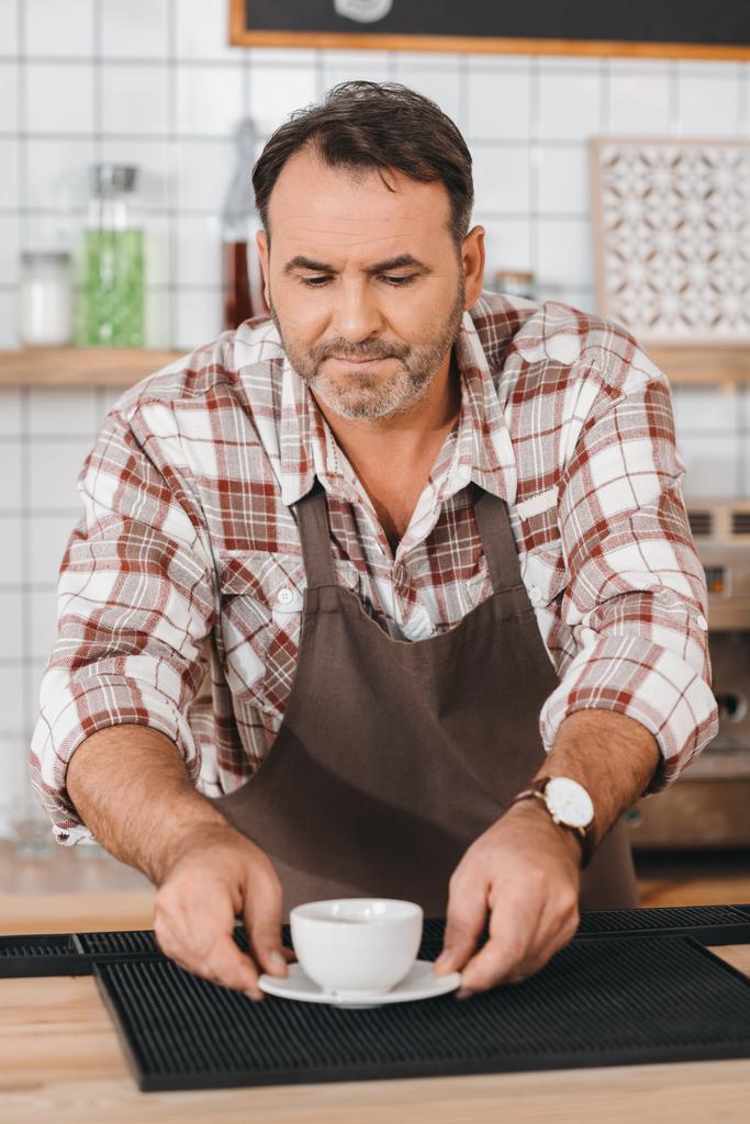 bartender putting coffee on bar counter - Photo, Image