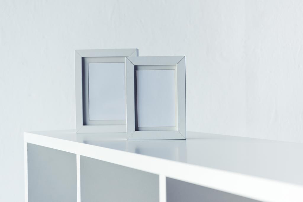 empty photo frames on bookshelf  - Photo, Image