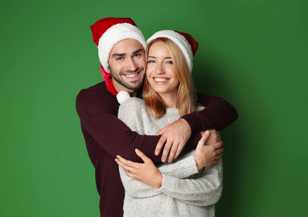 young couple in Santa hats - Photo, Image