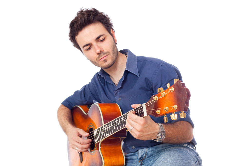 молодий чоловік грає на гітарі
 - Фото, зображення