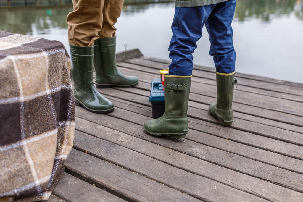 father and son in rubber boots - Photo, Image