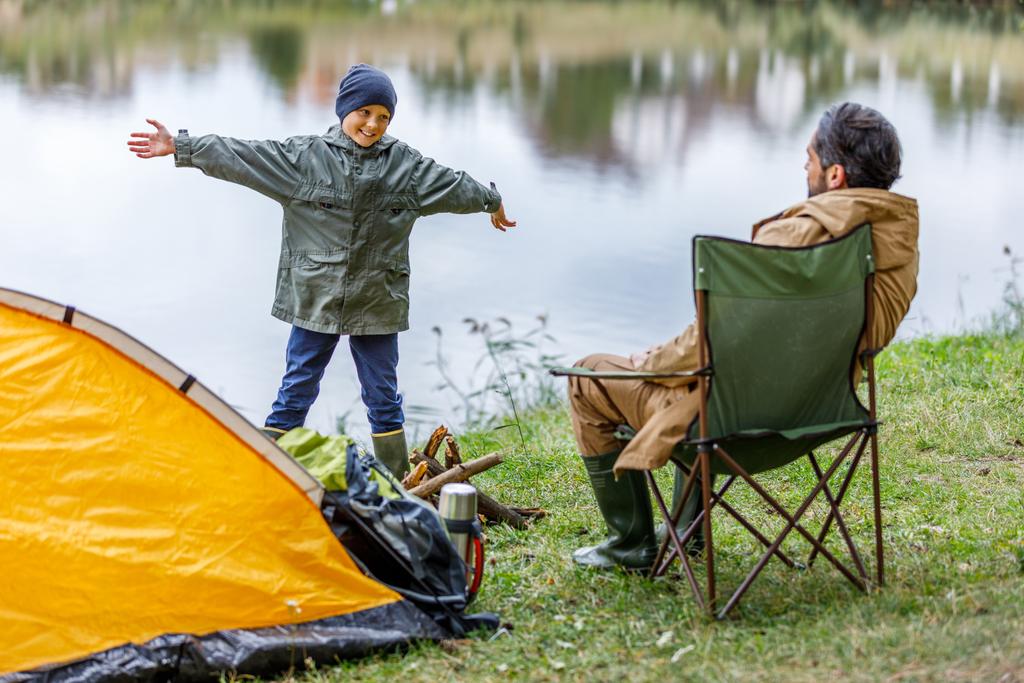 father and son in camping at lake - Photo, Image