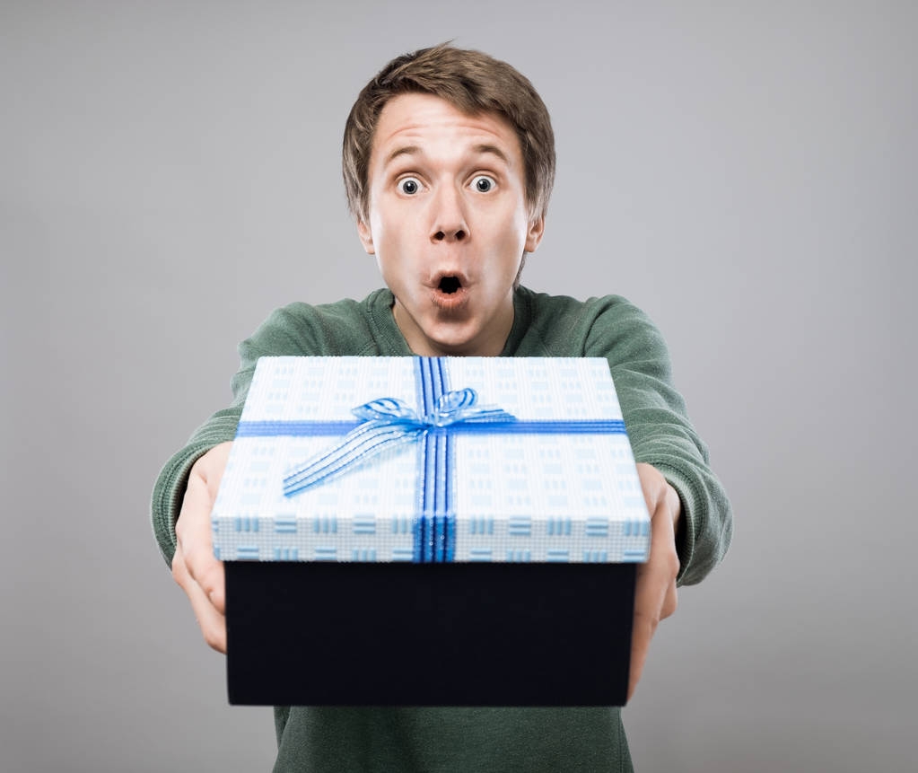 Young man with gift - Photo, Image